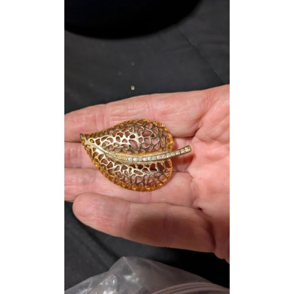 gold filigree leaf brooch pin with a rhinestone stem